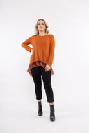 Women’s Knit Long Sleeve Tunic. Composition: 53% Viscose, 22% Polyester, 20% Nylon and 5% Spandex. 