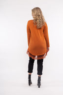 Women’s Knit Long Sleeve Tunic. Composition: 53% Viscose, 22% Polyester, 20% Nylon and 5% Spandex. 