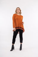 Women’s Knit Long Sleeve Tunic. Composition: 53% Viscose, 22% Polyester, 20% Nylon and 5% Spandex. 