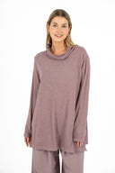 WOMEN'S COWL-NECK LONG SLEEVE TUNIC, WITH LOOSE FLAP PANELS AT THE SIDE SEAMS. A COMBINATION OF SOLID KNIT AND PRINTED WOVEN MATERIALS